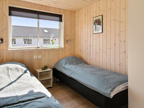 a bedroom with two beds and a window at Holiday home Kappeln IV in Kappeln