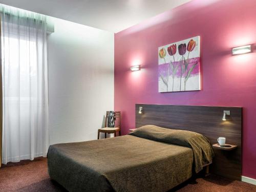 Кровать или кровати в номере Aparthotel Adagio Access Paris Porte De Charenton