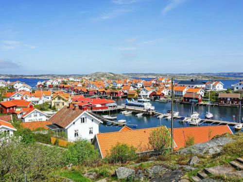 a town with a harbor with boats in the water at Holiday home Gullholmen in Gullholmen