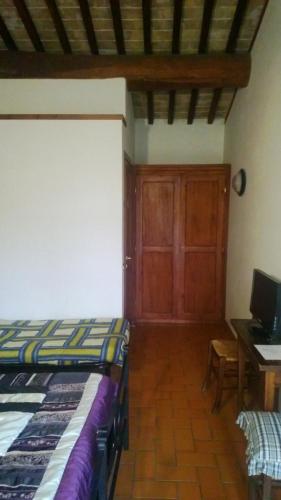 Postel nebo postele na pokoji v ubytování Agriturismo Pomonte