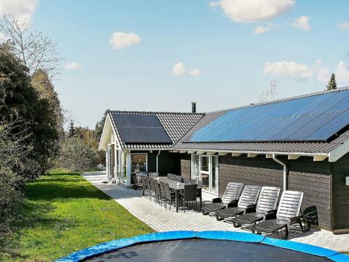 una casa con pannelli solari su un lato di essa di 14 person holiday home in Hornb k a Hornbæk
