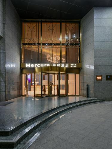 an entrance to a building with a sign on it at Mercure Xiamen Zhongshan Road Pedestrian Street Seaview in Xiamen