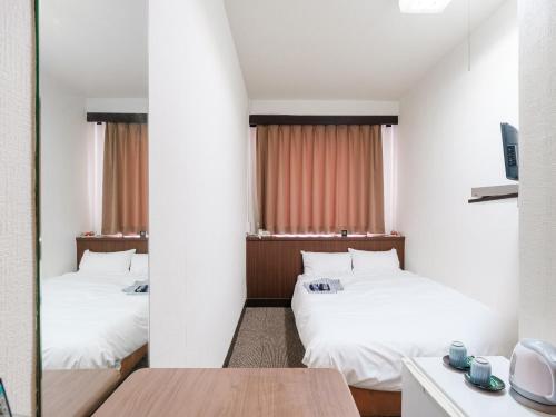 Ένα ή περισσότερα κρεβάτια σε δωμάτιο στο Tabist Hotel Tetora Hakodate Station