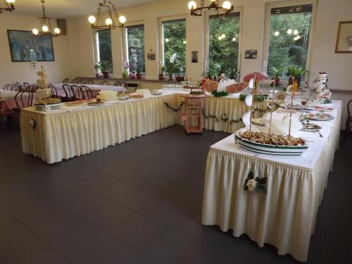 a group of tables with white table cloths at Albergo Ristorante Turchino in Campo Ligure