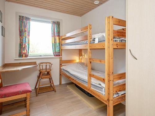 Postel nebo postele na pokoji v ubytování Holiday Home Helmklit II