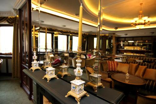 a room with a table with items on it at Retro Riverside Wellness Resort in Karlovy Vary