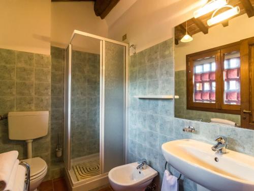 a bathroom with a sink and a shower at Scenic Apartment Near Pian di Sco with Private Terrace in Pian di Scò