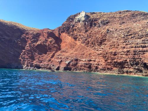 a view of a mountain from the water at Casa del porticciolo di Capraia in Capraia