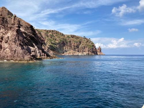 a view of a rocky island in the ocean at Casa del porticciolo di Capraia in Capraia