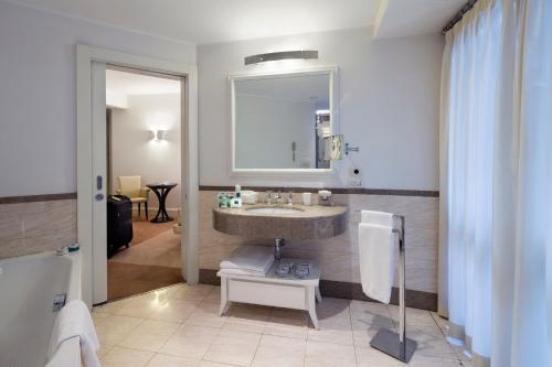 a bathroom with a sink and a mirror at Maison Milano | UNA Esperienze in Milan