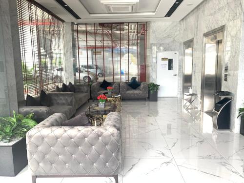a living room with a couch and a table at TK VIEW HOTEL & APARTMENT in Phnom Penh