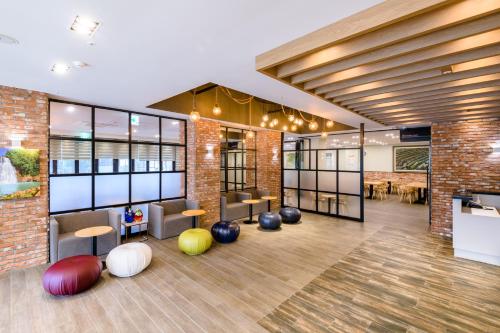 a lobby with colorful balls on the floor at Shin Shin Hotel Cheonjiyeon in Seogwipo