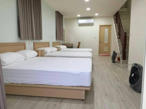 Een bed of bedden in een kamer bij Daxi GanDan Villa