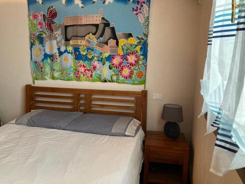 Postel nebo postele na pokoji v ubytování Casa a Capraia porticciolo: vista mare indimenticabile!