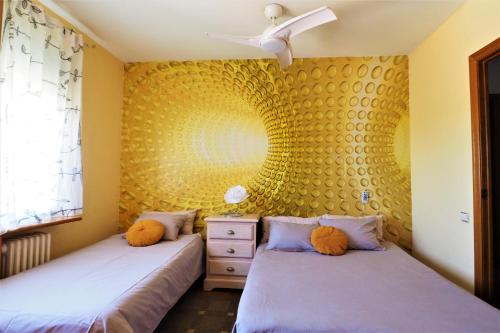 A bed or beds in a room at Carmen Seaview & Beach - Apartment