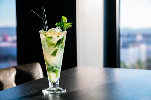a drink sitting on top of a wooden table at Crowne Plaza Plymouth by IHG in Plymouth