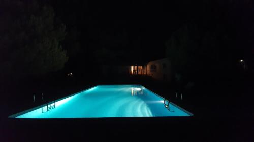 a swimming pool in the dark at night at Villa Sal - Spacious, private Apartment in a Villa with pool in Alcácer do Sal