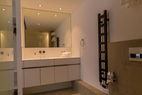 a bathroom with a sink and a mirror at HGS³ in Schelklingen