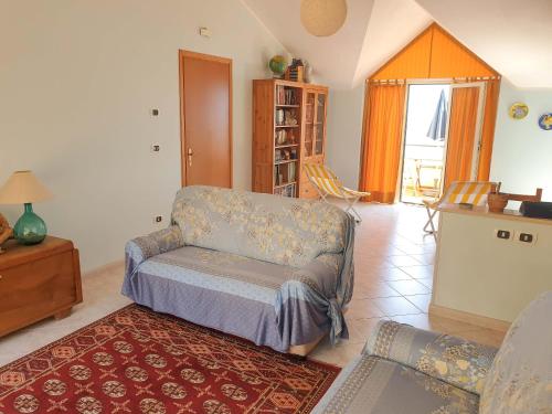 a living room with a couch and a table at Casa Vacanze Umberto I in Bova Marina