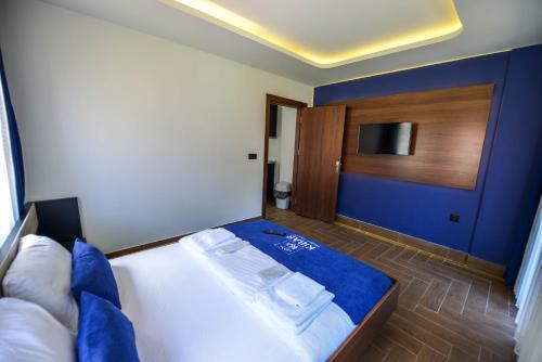Ένα ή περισσότερα κρεβάτια σε δωμάτιο στο Kibar Suite Hotel