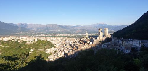 a view of a city with mountains in the background at Casa Alessandro in Pacentro