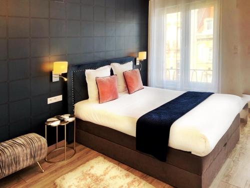 Ένα ή περισσότερα κρεβάτια σε δωμάτιο στο Goodtime Apartments Strasbourg