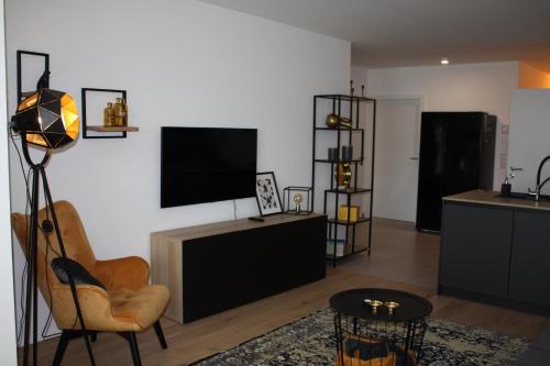 TV a/nebo společenská místnost v ubytování Top 20 Alpe Maritima - Ferienapartment Alps & Lake
