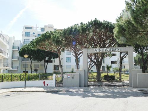 a sign for a villa in front of a building at Vila Falesia Penthouse in Albufeira