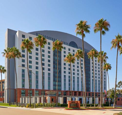 a large building with palm trees and palm trees at Hyatt Regency La Jolla at Aventine in San Diego
