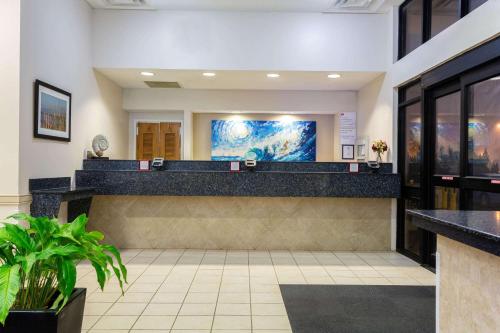 a lobby of a hospital with a reception counter at Ramada Plaza by Wyndham Virginia Beach Oceanfront in Virginia Beach
