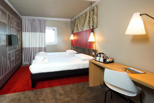 Ένα ή περισσότερα κρεβάτια σε δωμάτιο στο ibis Leicester