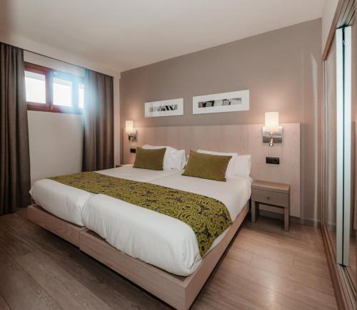 a bedroom with a large bed in a room at Marins Playa in Cala Millor