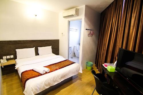 Katil atau katil-katil dalam bilik di Hotel Rasah Seremban