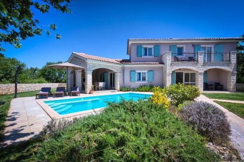 an image of a villa with a swimming pool at Villa Krmed in Krmed