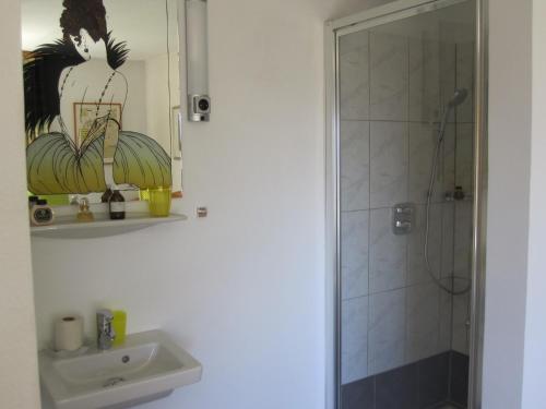 a bathroom with a sink and a shower at Ferienhaus Weixelbraun in Iselsberg