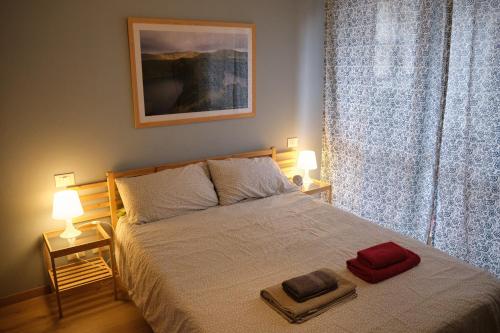 a bedroom with a bed with two towels on it at La Casetta del Viaggiatore - "Traveller's Home" in Torre del Lago Puccini