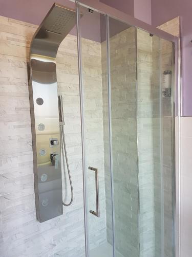 a shower with a glass door in a bathroom at Villa Bellavista Alba, B&B in Alba