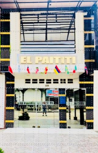 a building with a sign that reads el parking at El Paititi Hotel in Iquitos