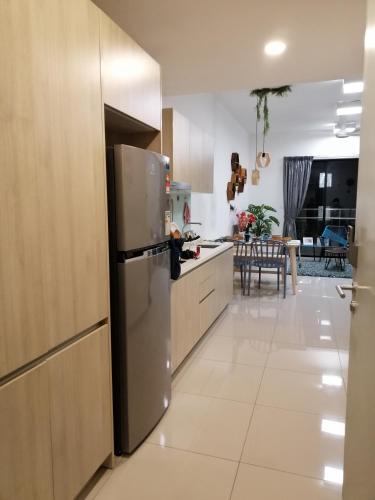 a kitchen with a stainless steel refrigerator and a table at NORDIC Geniehome2BR1studio Free 90mbps WIFI and Carpark at Utropolis Suite Shah Alam in Shah Alam