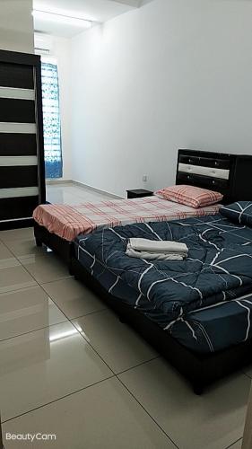 a bed sitting in a room with at FangFei Homestay in Seremban
