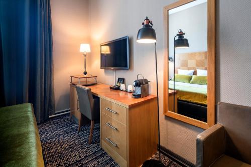 Kuchyň nebo kuchyňský kout v ubytování The Alfred Hotel