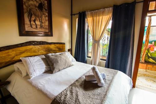 Postel nebo postele na pokoji v ubytování Finca Hotel Yerbabuena
