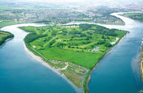an aerial view of a group of islands in the water at Waterford Castle Hotel Lodges in Waterford
