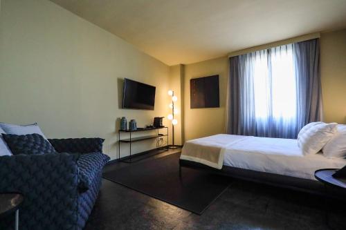 Ένα ή περισσότερα κρεβάτια σε δωμάτιο στο Arco Vecchio Urban Suite - Epoca Collection