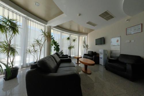 a living room with a couch and a table at Motel Mujanic Sarajevo in Sarajevo