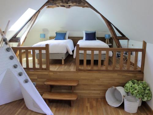 a bedroom with two beds in a tent at Chambre d'hotes Les Rives de la Tronne in Mer