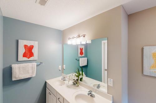 a bathroom with a sink and a mirror at Lake Casa in Norris