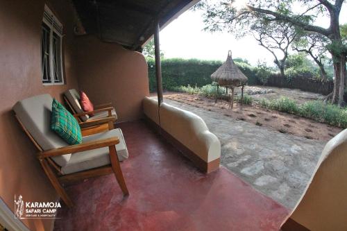a room with a couch and a chair and a table at Kara-Tunga Safari Camp in Moroto