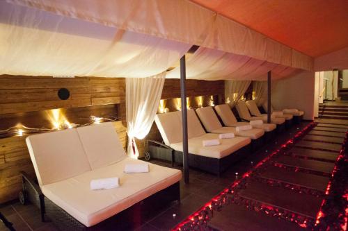 a row of beds in a room with christmas lights at Der Schütthof in Zell am See
