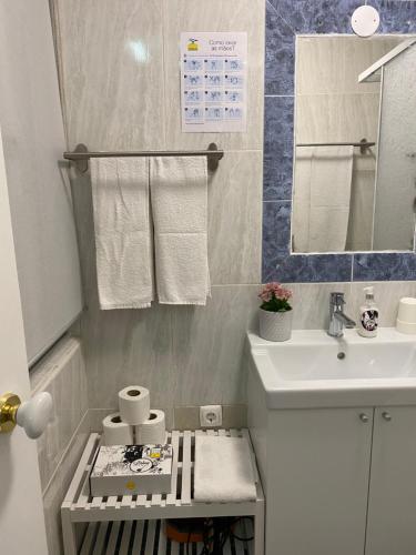 a small bathroom with a sink and a toilet at Mouraria 1 - Descubra a Lisboa Medieval in Lisbon